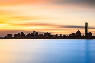 The Boston skyline at sunset across the Charles River